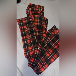 Red and black plaid flared stretch pants.